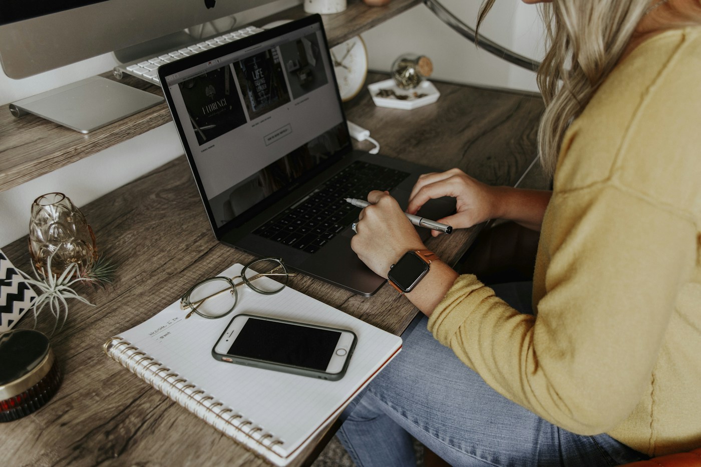 Laptop, notes, and phone on a business workspace